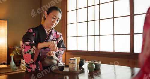 Preview: Traditional, culture and Japanese woman with tea in home with herbs, leaves and flavor in teapot. K