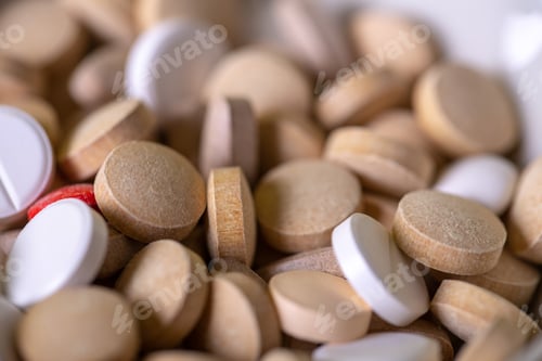 Preview: Close up on gray and white pills