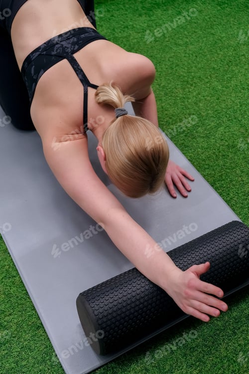 Preview: Myofascial release massage Fitness,fit,Girl engaged in stretching fascia fitness gym. MFR,Wellness,