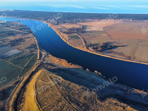 Preview: Drone shot of a river in a field