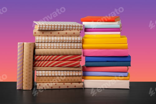 Preview: Stack of books on black wooden table