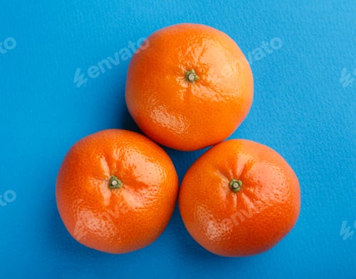 Preview: Ripe Mandarin Close-Up On A White Background. Tangerine Orange. Colorful Food And Drink Still Life