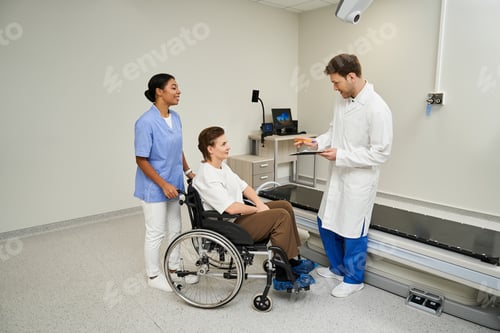 Preview: Caring healthcare team prepares patient for MRI scan in modern hospital setting