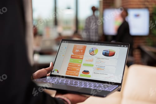 Preview: Businessman analyzing charts and graphs