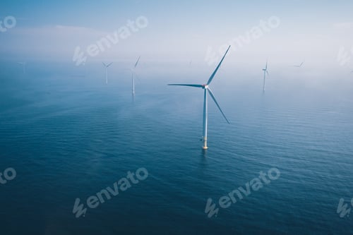 Preview: Wind turbine. Aerial view of wind turbines or windmills farm field in blue sea in Finland.