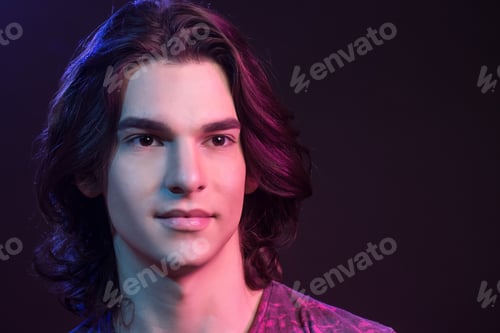Preview: Face Close Up, Caucasian Young Adult Man With Retouched Skin. Colored Gel Lights, Studio Shot