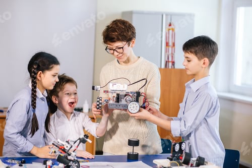 Preview: Happy children learn programming using laptops on extracurricular classes