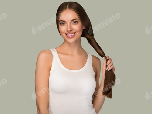 Preview: Beautiful woman with long smooth healthy hair tail beauty casual style. Color background green