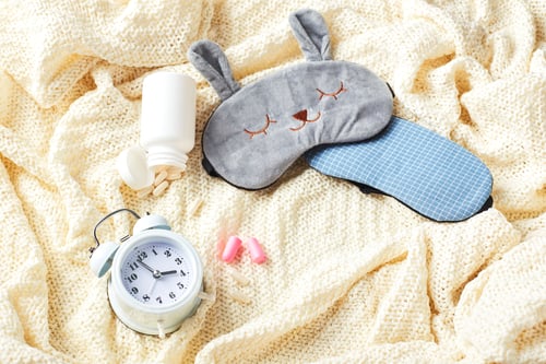 Preview: Sleeping mask, alarm clock, earplugs and pills. Healthy night sleep creative concept
