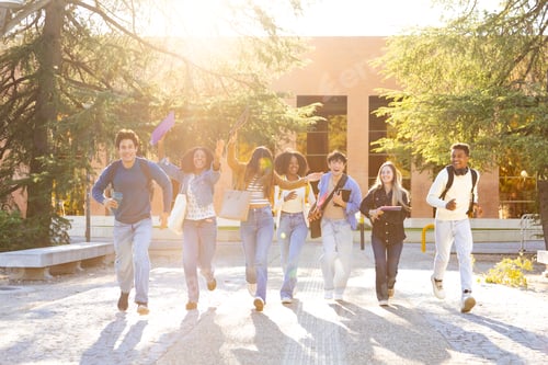 Preview: Diverse students running happily on university campus