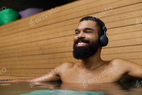 Preview: Relaxing moments of joy for a shirtless man enjoying wellness at a spa center