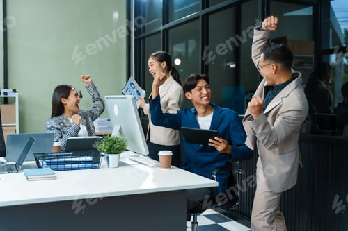 Preview: Asian colleagues meet at a desk, discussing business financial terms, investment strategies