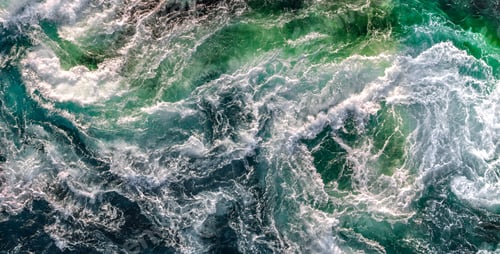 Preview: Blue waves of water of the river and the sea meet each other during high tide and low tide.