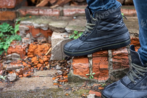 Preview: A pair of durable men's boots, legs close-up.