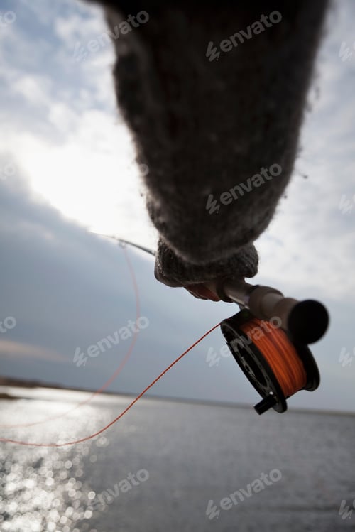 Preview: Close up of man using fishing rod
