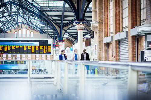 Preview: Three mature men at train station, walking together