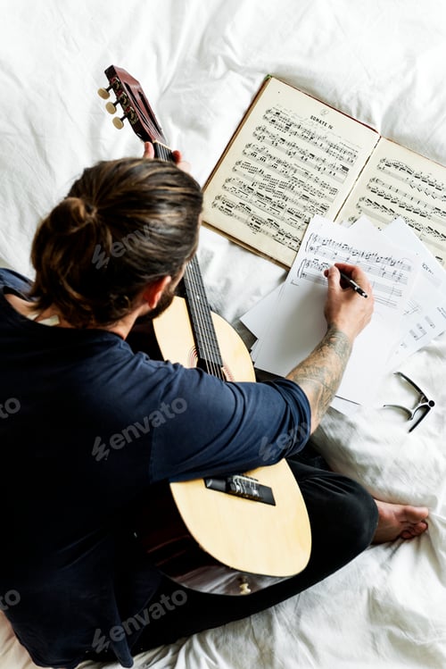Preview: Man playing guitar composing