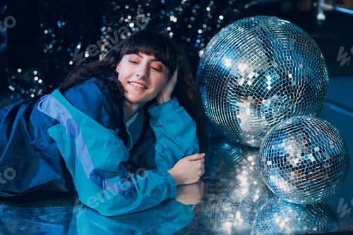 Preview: Young sporty woman 80 and 90's style. 90s fashion positive girl at night club disco party disco ball