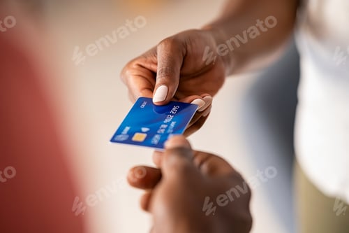 Preview: Black woman paying with credit card