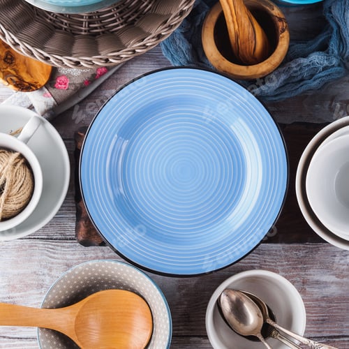 Preview: Ceramic and enamel crockery on wooden background