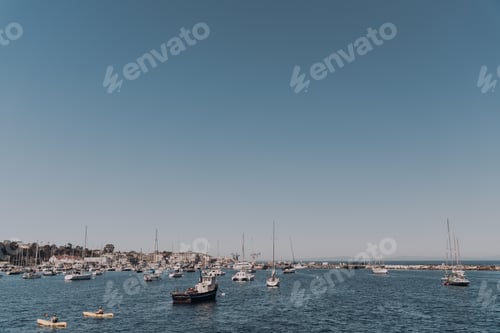 Preview: Docked boats at sunrise in Pacific Ocean