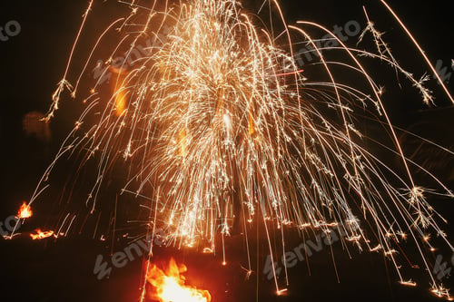 Preview: Fire dancers swing, spinning fire and man juggling with bright sparks in the night
