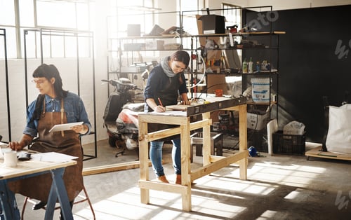 Preview: Cropped shot of two attractive young creative female artisans working in their workshop