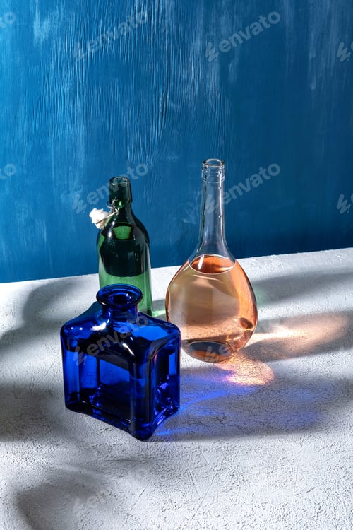 Preview: Minimal concept glasses bottles on sunny day.