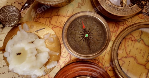 Preview: Vintage style travel and adventure. Vintage old compass and other vintage items on the table.