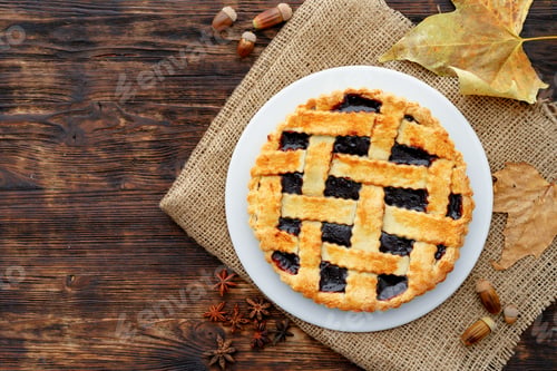 Preview: Close up of a berry tart pie on wooden table