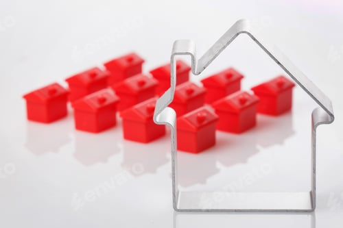 Preview: Toy houses and metallic shape of a house