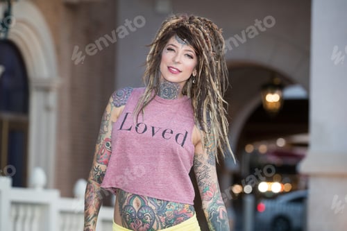 Preview: Beautiful hippie woman with tattoos and dreadlocks