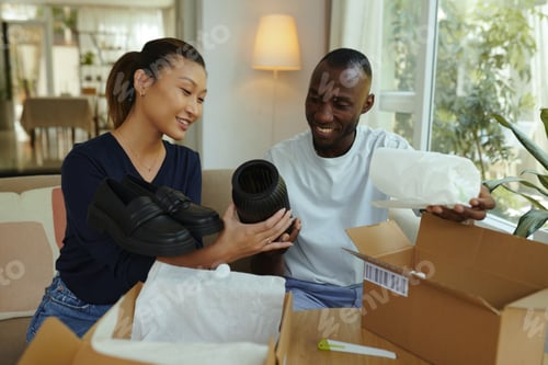 Preview: Couple Checking Goods After Delivery