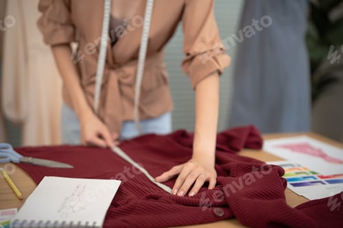 Preview: Stylish Fashion Designer work as sketch of new collection in atelier. Creative Design Concept