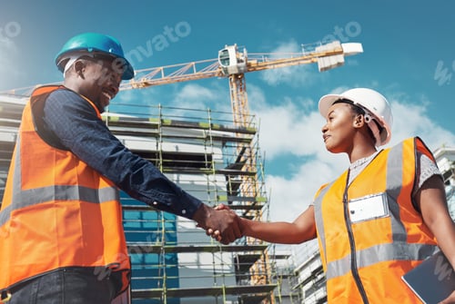 Preview: Shot of two builders shaking hands at a construction site