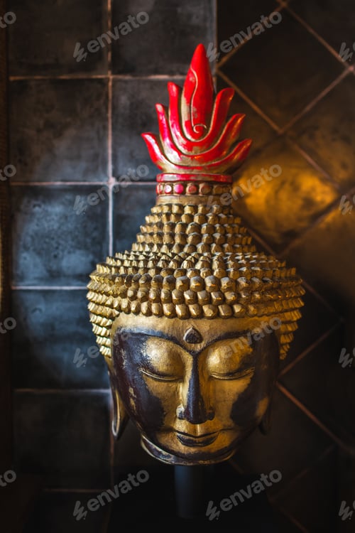 Preview: Golden Buddha face on dark tile background