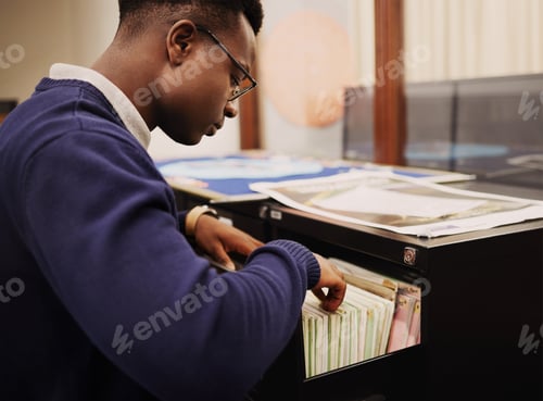 Preview: School research, campus and a black man in a library for knowledge, learning or studying. Universit