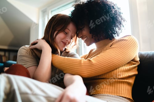 Preview: Lesbian women caressing on the couch