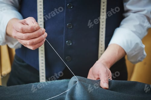 Preview: Seamster Hand-Sewing Material at the Workplace
