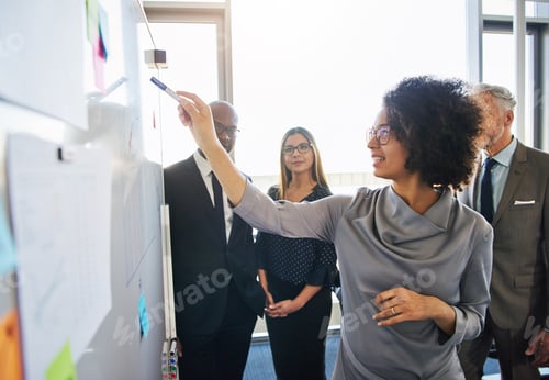 Preview: Diverse team of colleagues brainstorming together in a modern office