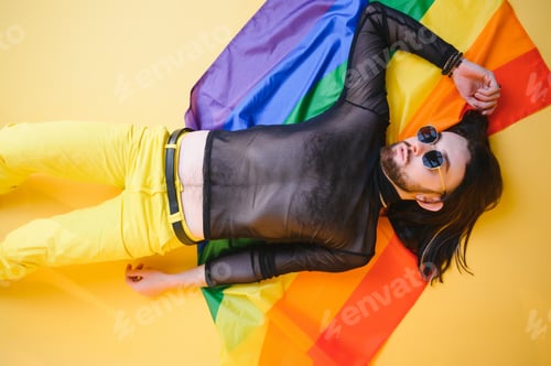 Preview: Handsome young man with pride movement LGBT Rainbow flag