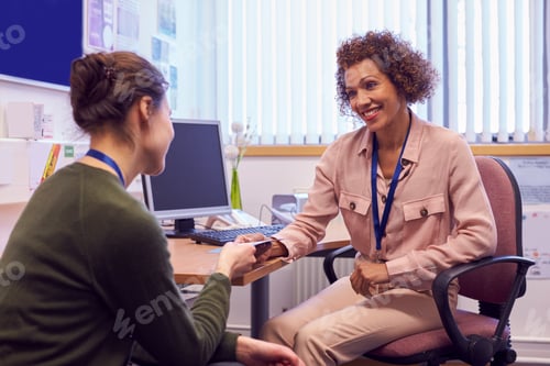Preview: Female College Student Meeting With Campus Counselor Discussing Mental Health Issues