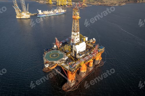 Preview: Oil and Gas Drilling Platform at Sea at Sunset