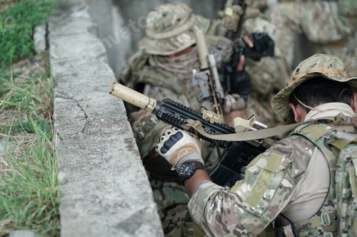 Preview: Soldier in full US MARSOC armed with assault rifle run through the abandoned building. Military