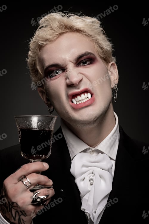 Preview: Young handsome man embraces Halloween spirit in a striking costume and dramatic makeup
