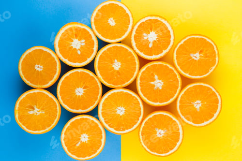Preview: Cut Halves Of Juicy Orange On Yellow Blue Background. Orange Fruit, Citrus Minimal Concept
