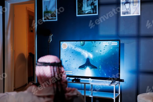 Preview: Man playing space shooter game on tv