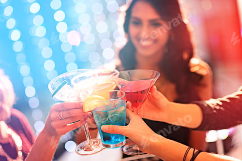 Preview: Toast to the weekend. Cropped shot of a group of women celebrating with cocktails at a party.