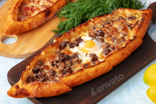 Preview: Close up of Turkish Pide bread on wooden table