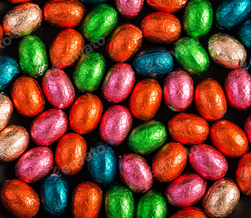 Preview: Colorful Easter eggs background. Chocolate Easter eggs texture. Top view